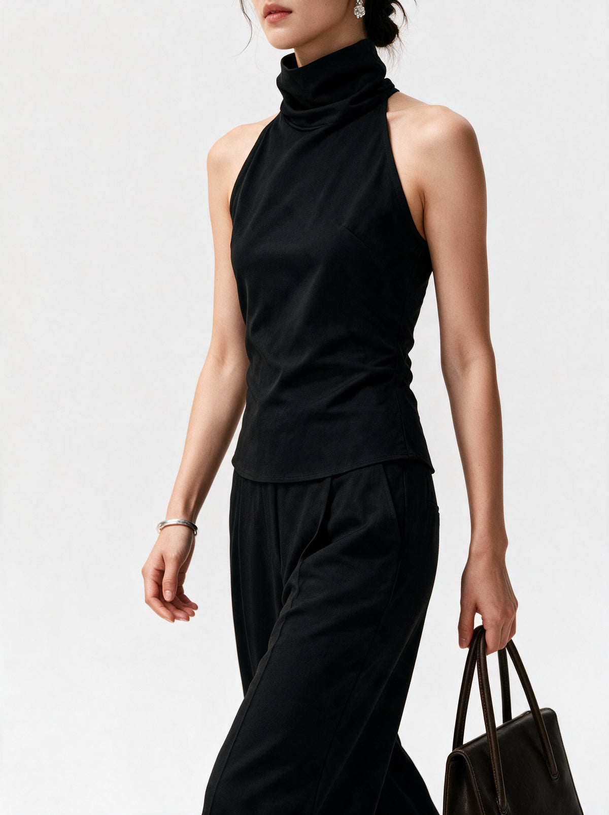 BLACK HIGH NECK TOP — model side detail