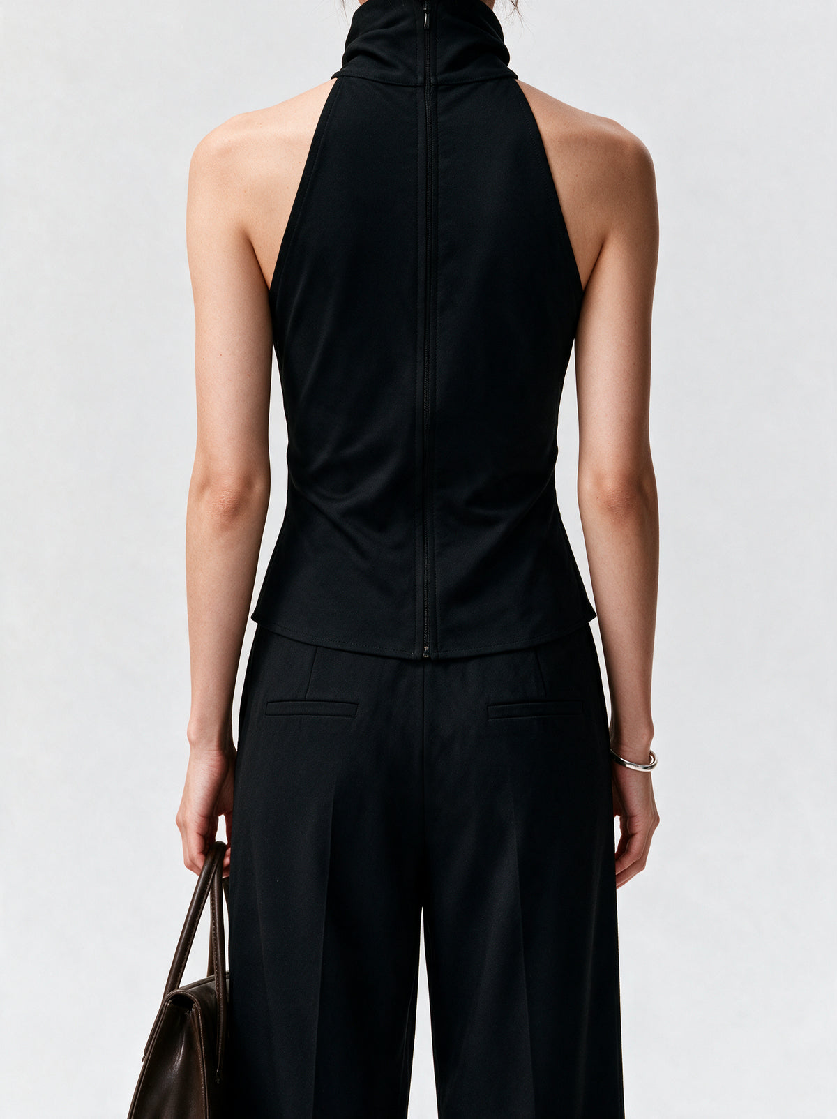 BLACK HIGH NECK TOP — model back view