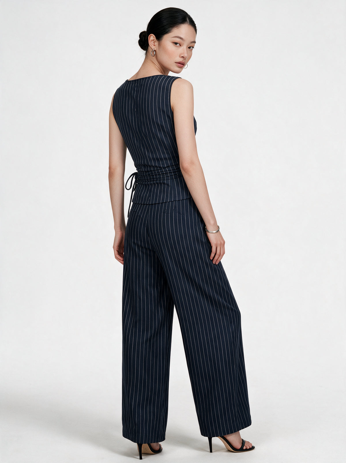 Valeria Pinstripe Asymmetric Wrap Top - Navy Pinstripe — model full body