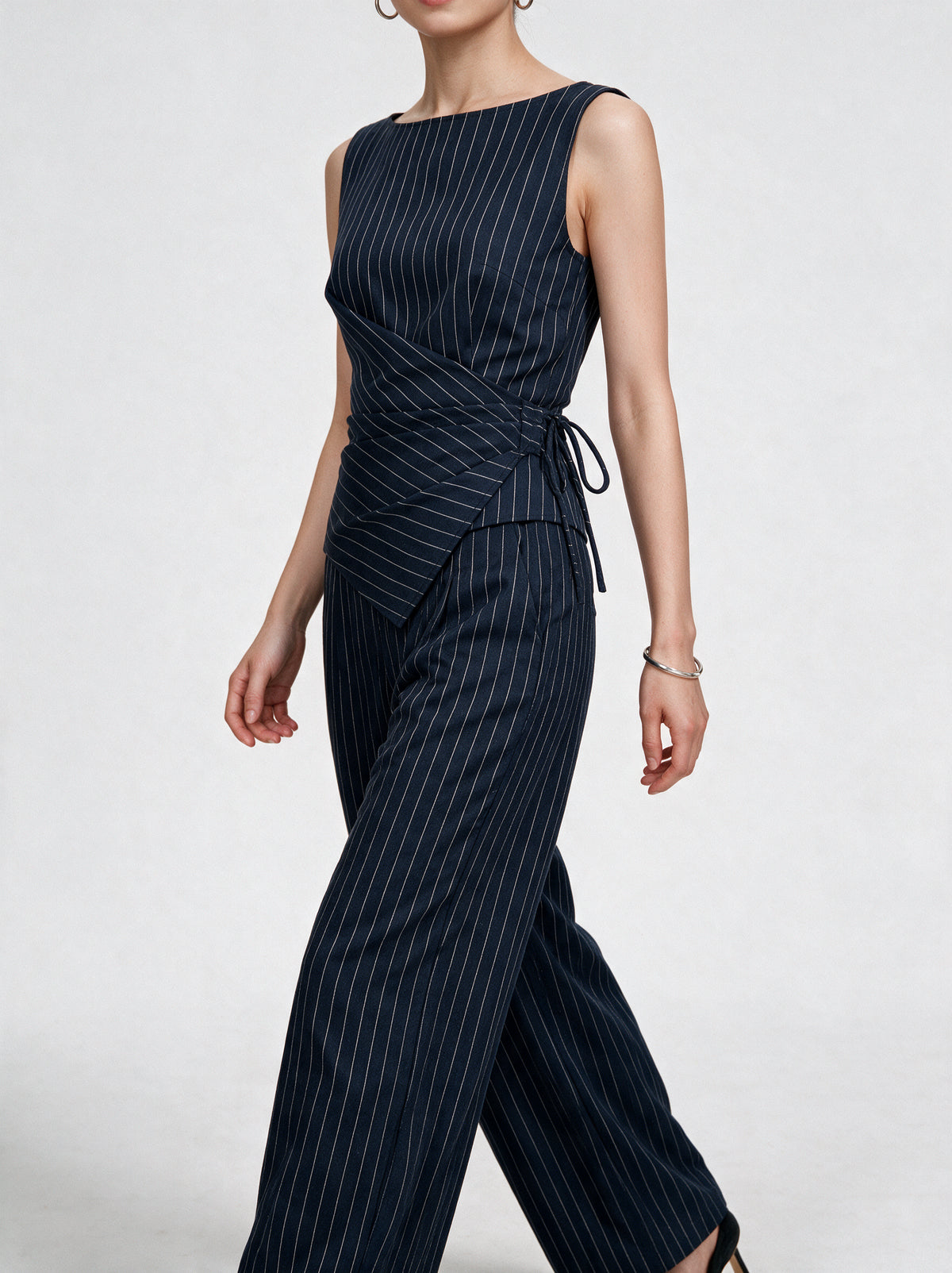 Valeria Pinstripe Asymmetric Wrap Top - Navy Pinstripe — model side detail