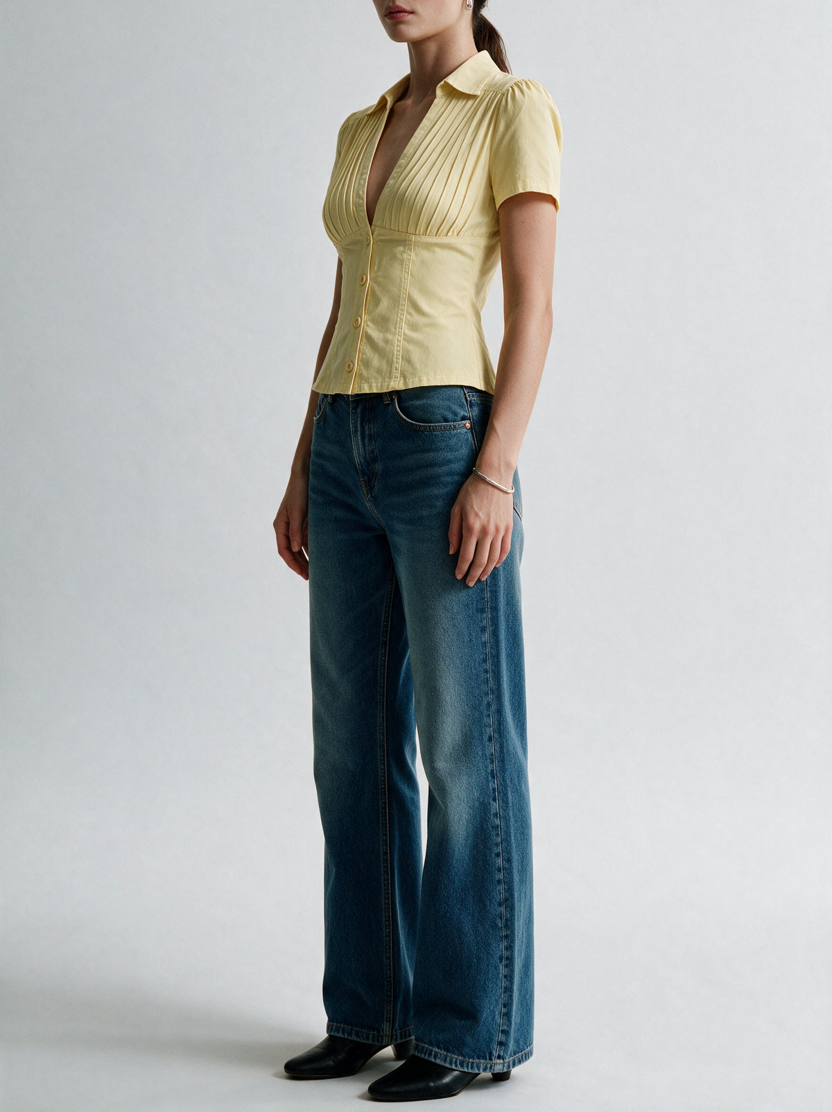Valeria Pleated Plunge Shirt - Butter Yellow — model side detail